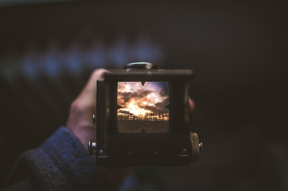 Free Image of Person Holding Small Television 
