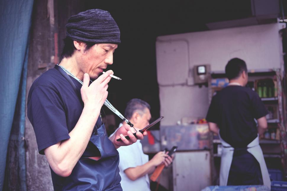 Free Image of Two Men Smoking Cigarettes 