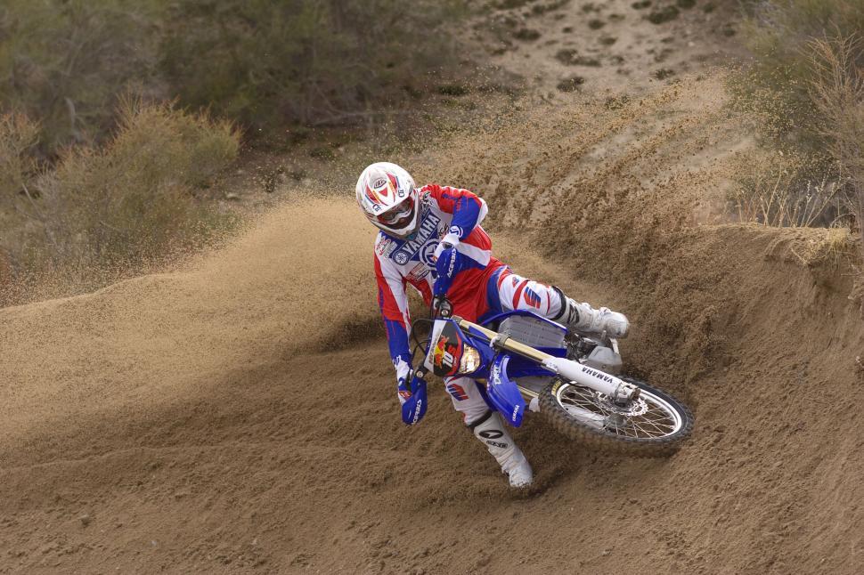 Free Image of Man Riding Dirt Bike on Dirt Field 