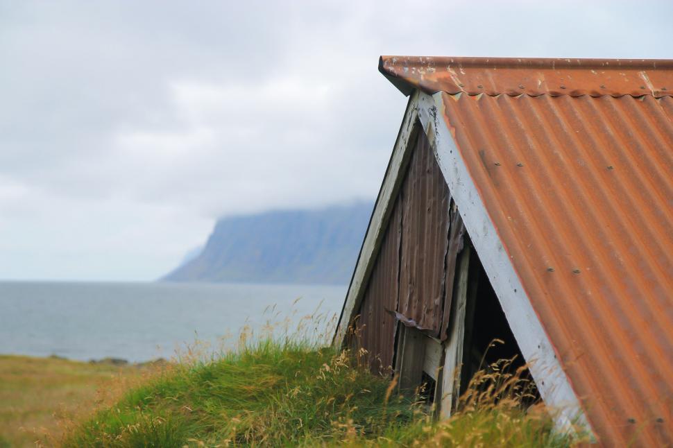 Free Image of Red Roof Building by Waterfront 