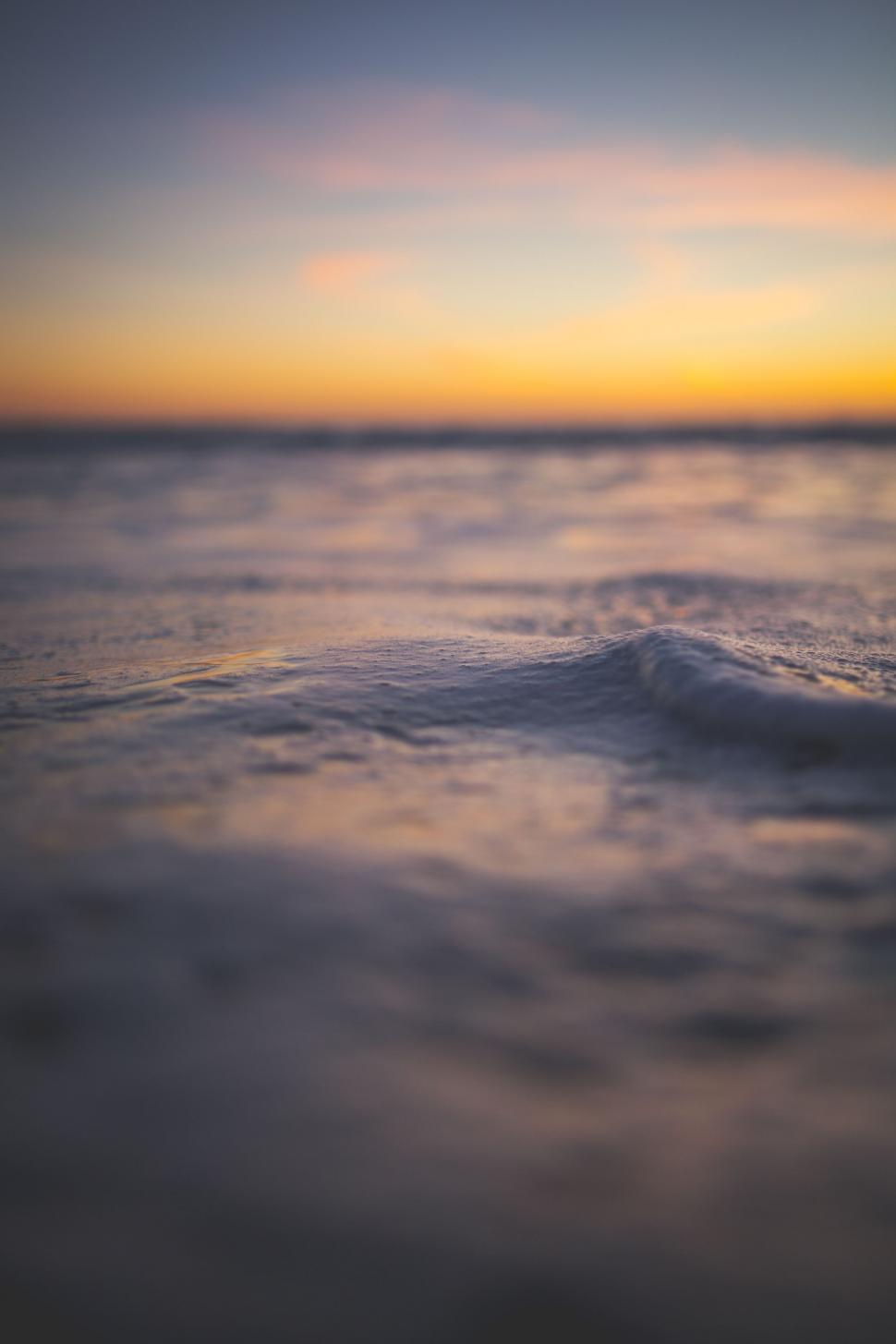 Free Image of Sunset Over a Body of Water 