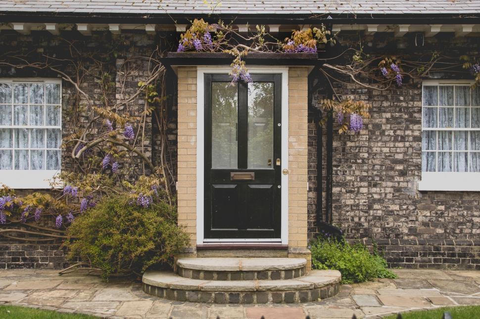 Free Image of Brick House With Black Front Door 