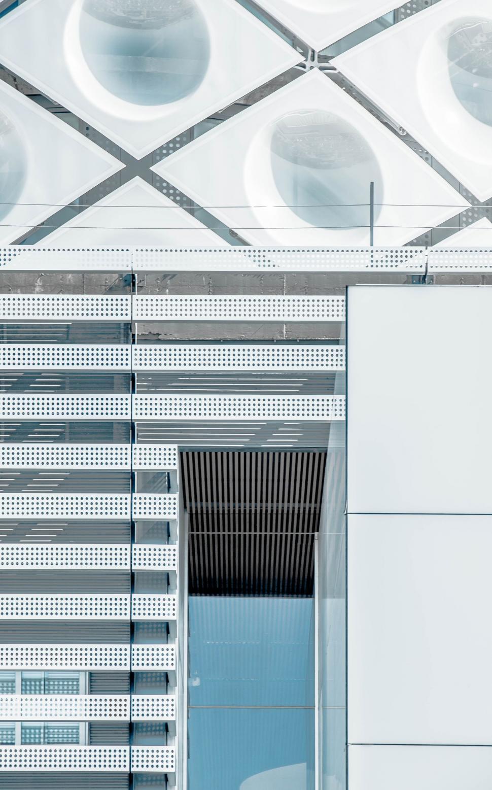 Free Image of White Building With Door and Lights 