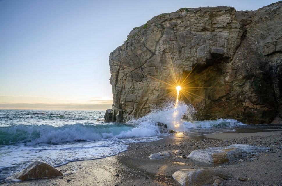 Free Image of Bright Light Shining in Middle of Ocean 
