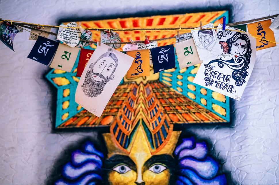 Free Image of Colorful Mask Hanging on Wall 