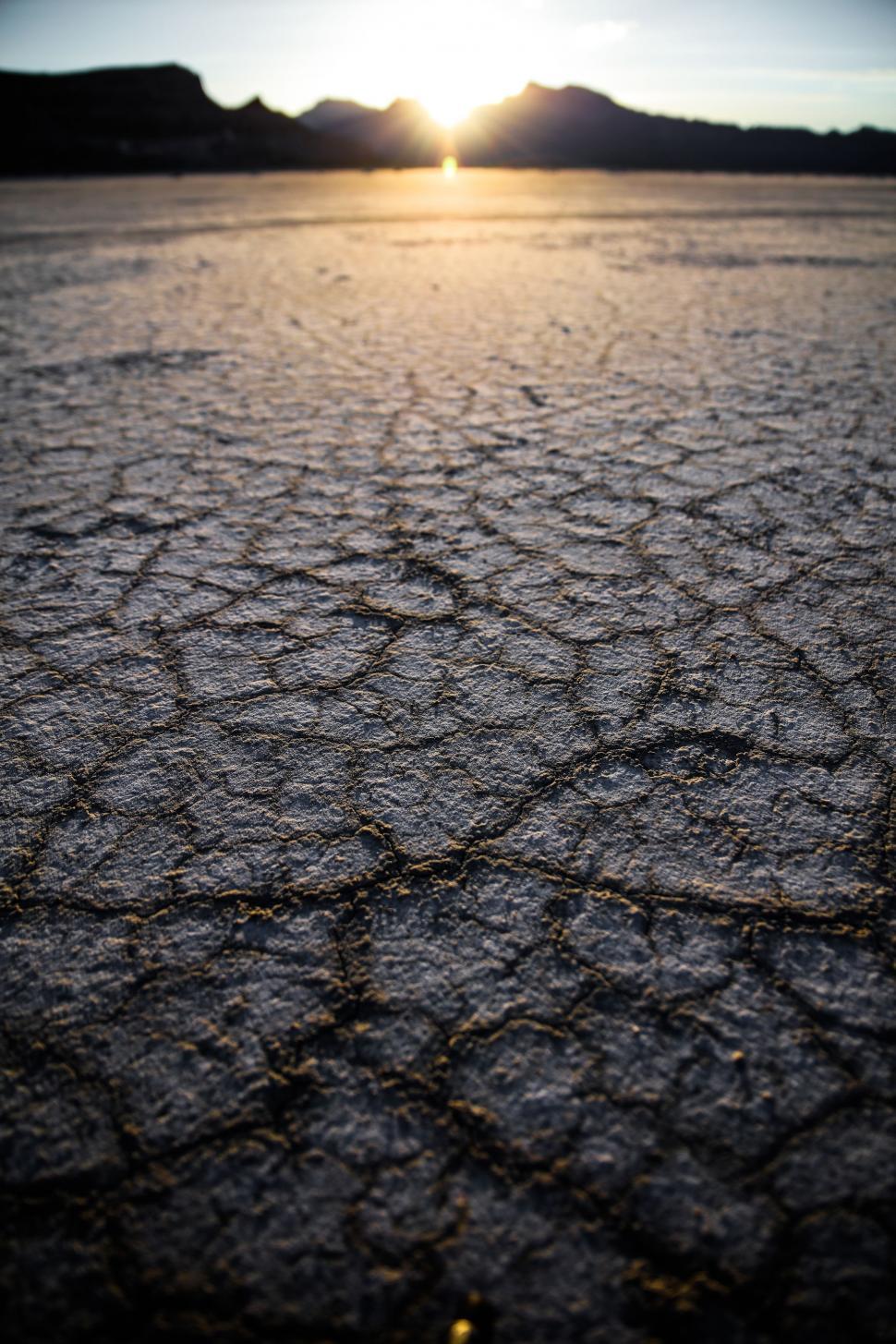 Free Image of Sun Setting Over Barren Landscape 