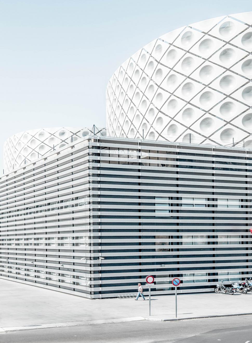 Free Image of Large White Building Next to Street 