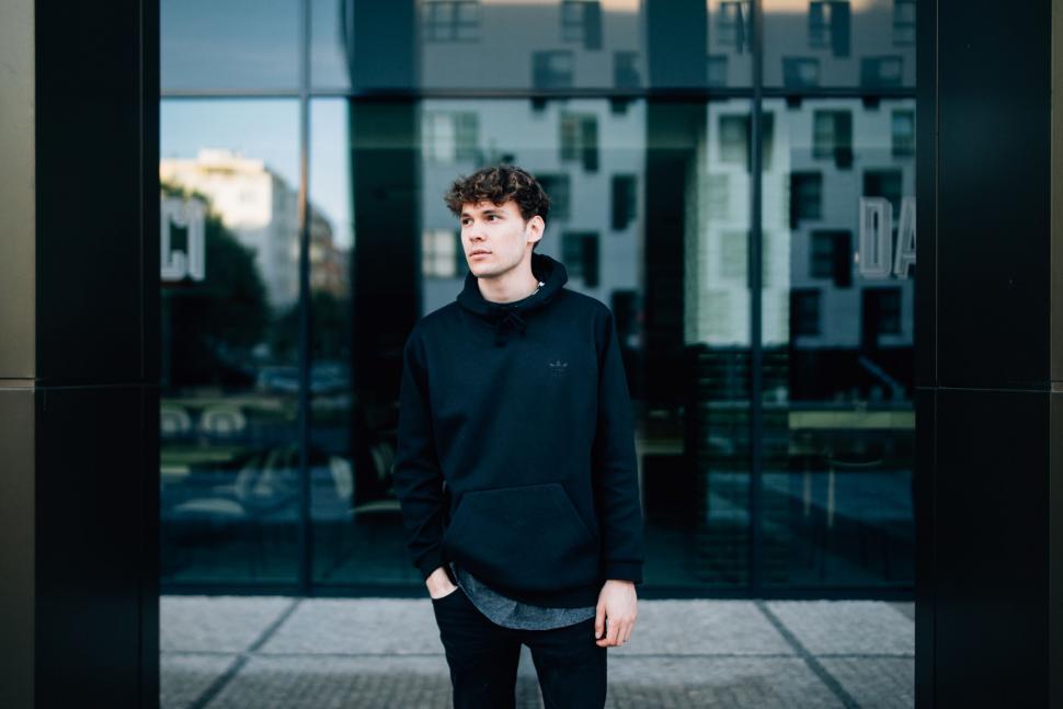 Free Image of Man Standing in Front of Building 