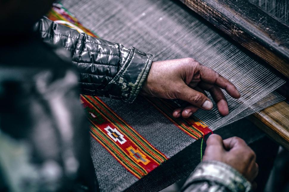 Free Image of Person Weaving on a Loom 
