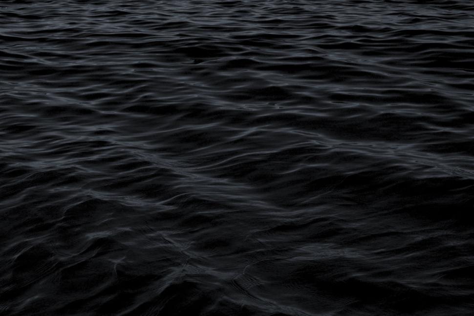 Free Image of Boat Sailing Across Vast Water 