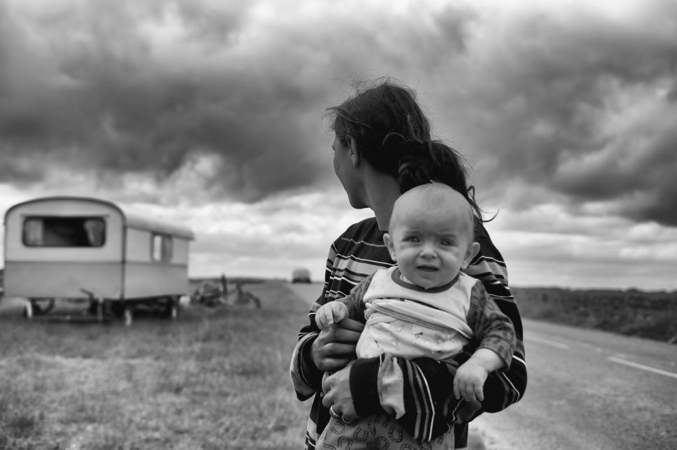 Free Image of Woman Carrying Baby 