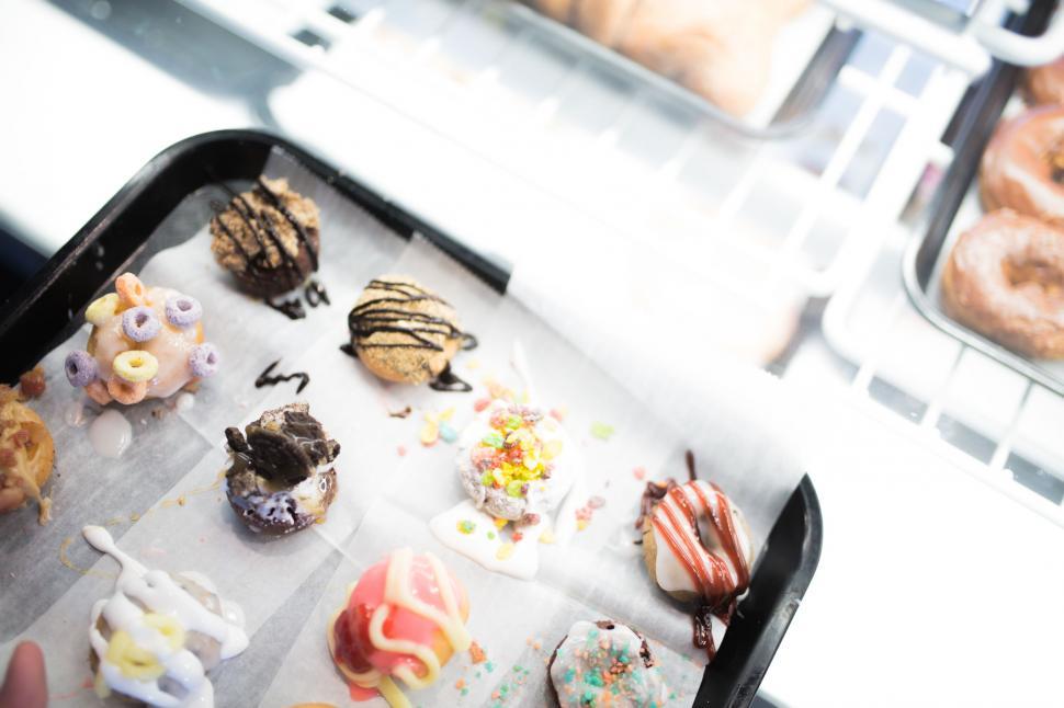 Free Image of Person Holding Tray of Doughnuts 