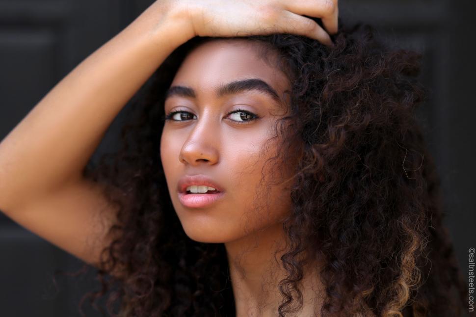 Free Image of Close-up Portrait of Person With Curly Hair 