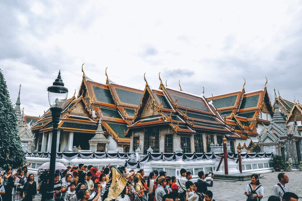 Free Image of Group of People Standing in Front of a Building 