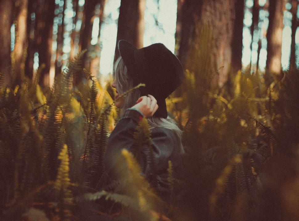 Free Image of Person Standing in Forest With Tall Grass 