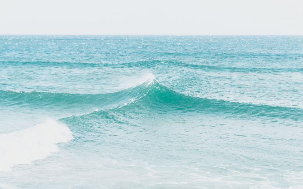 Free Image of Person Riding Surfboard on Ocean Wave 