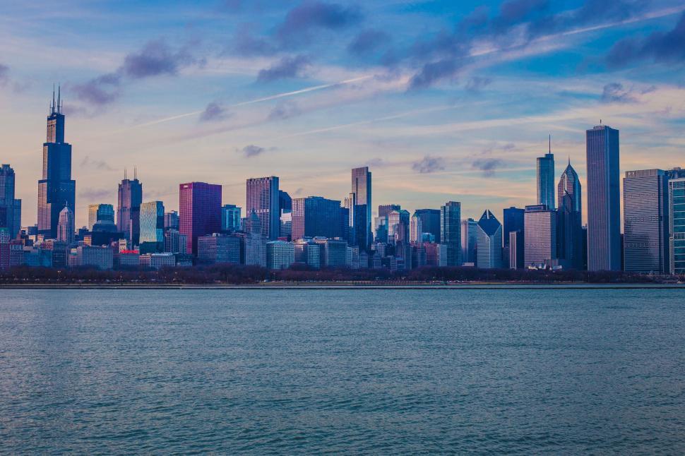 Free Image of City Skyline Overlooking Vast Body of Water 
