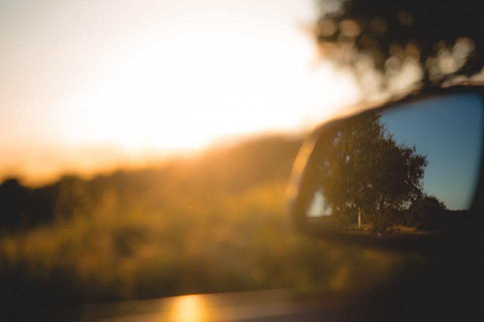 Free Image of Rear View Mirror Reflecting Car and Road 