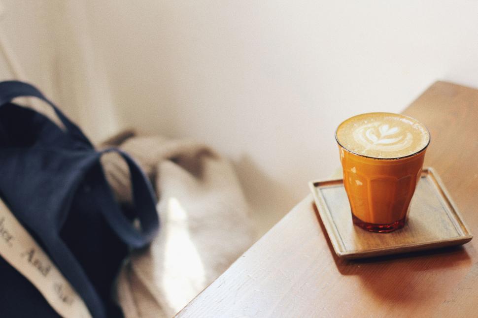 Free Image of A Cup of Coffee on Wooden Table 