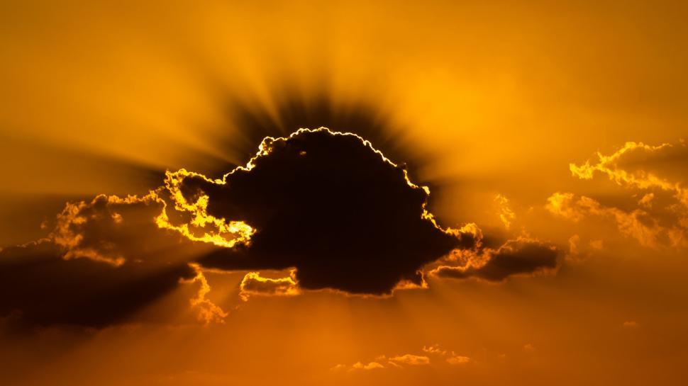 Free Image of Sun Shining Through Clouds in the Sky 