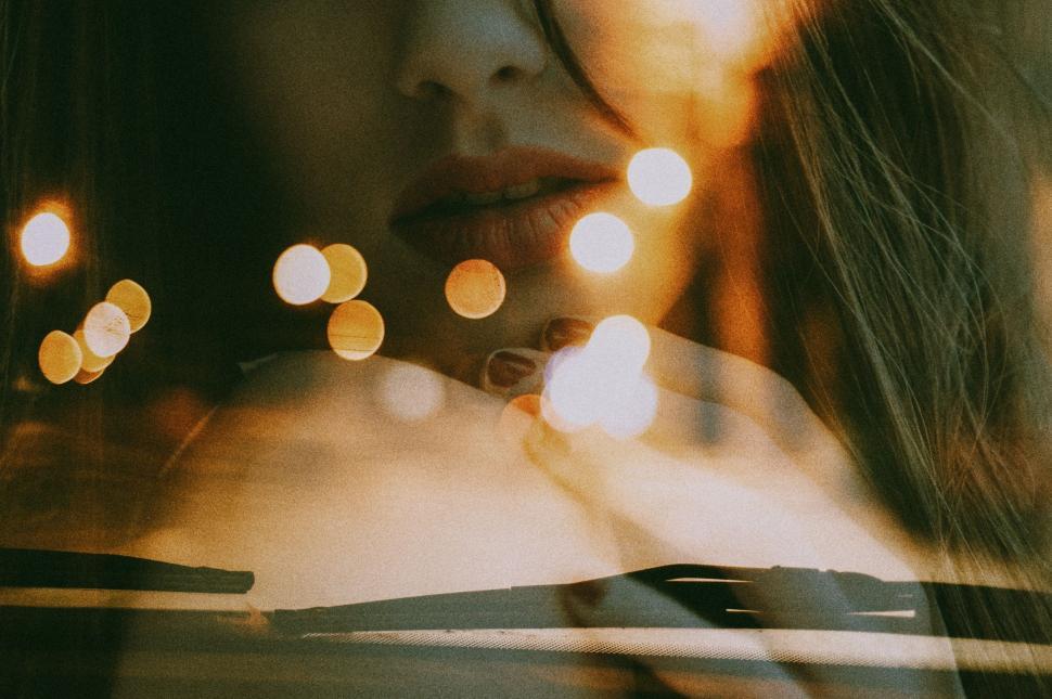 Free Image of Woman Looking Out of Car Window 