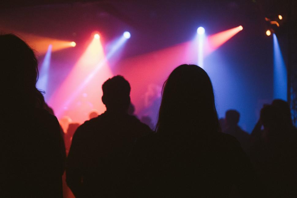 Free Image of Group of People Standing on Top of a Stage 