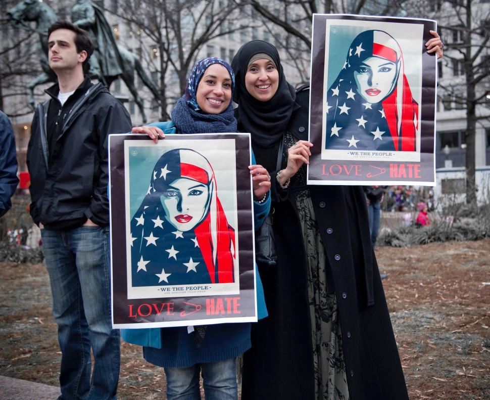 Free Image of Group of People Holding Up Posters in Front of Building 