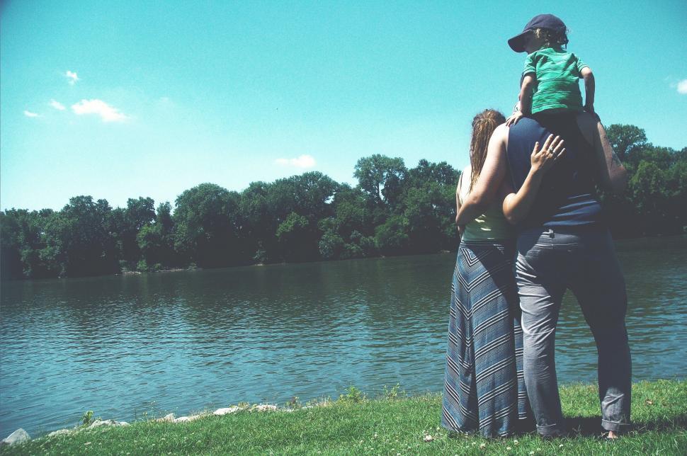 Free Image of Man Holding Child on Shoulders 