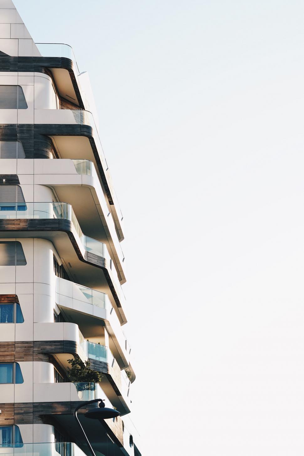 Free Image of Tall White Building With Balconies and Balconies 