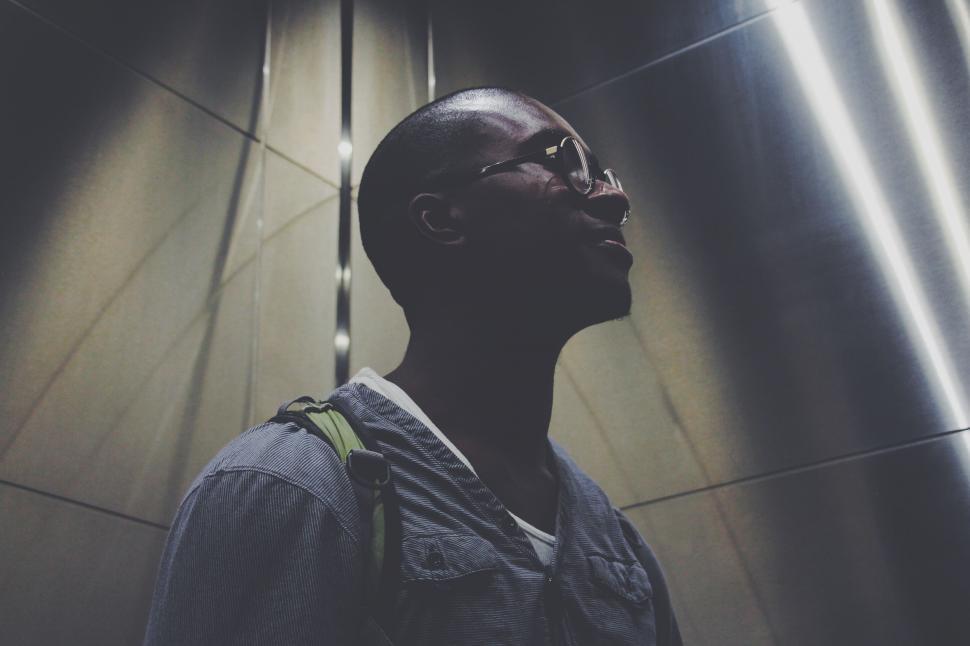Free Image of Man Standing in Front of Wall 