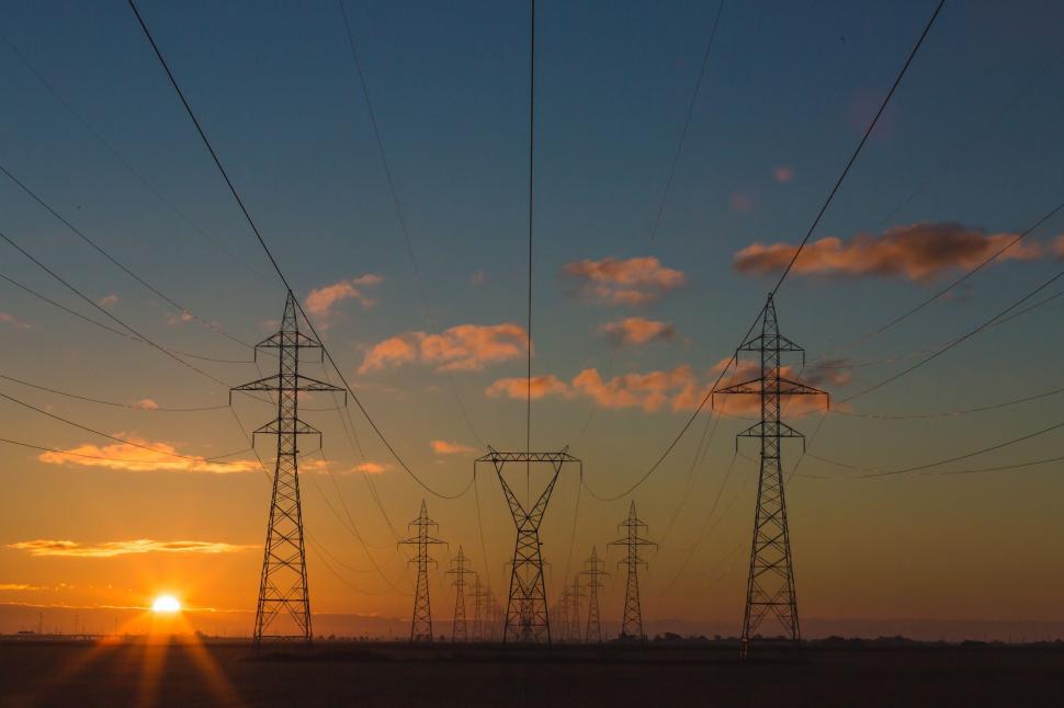 Free Image of Sun Setting Behind Power Lines 