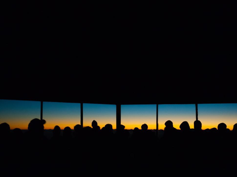 Free Image of Group of People Standing in Front of Window 