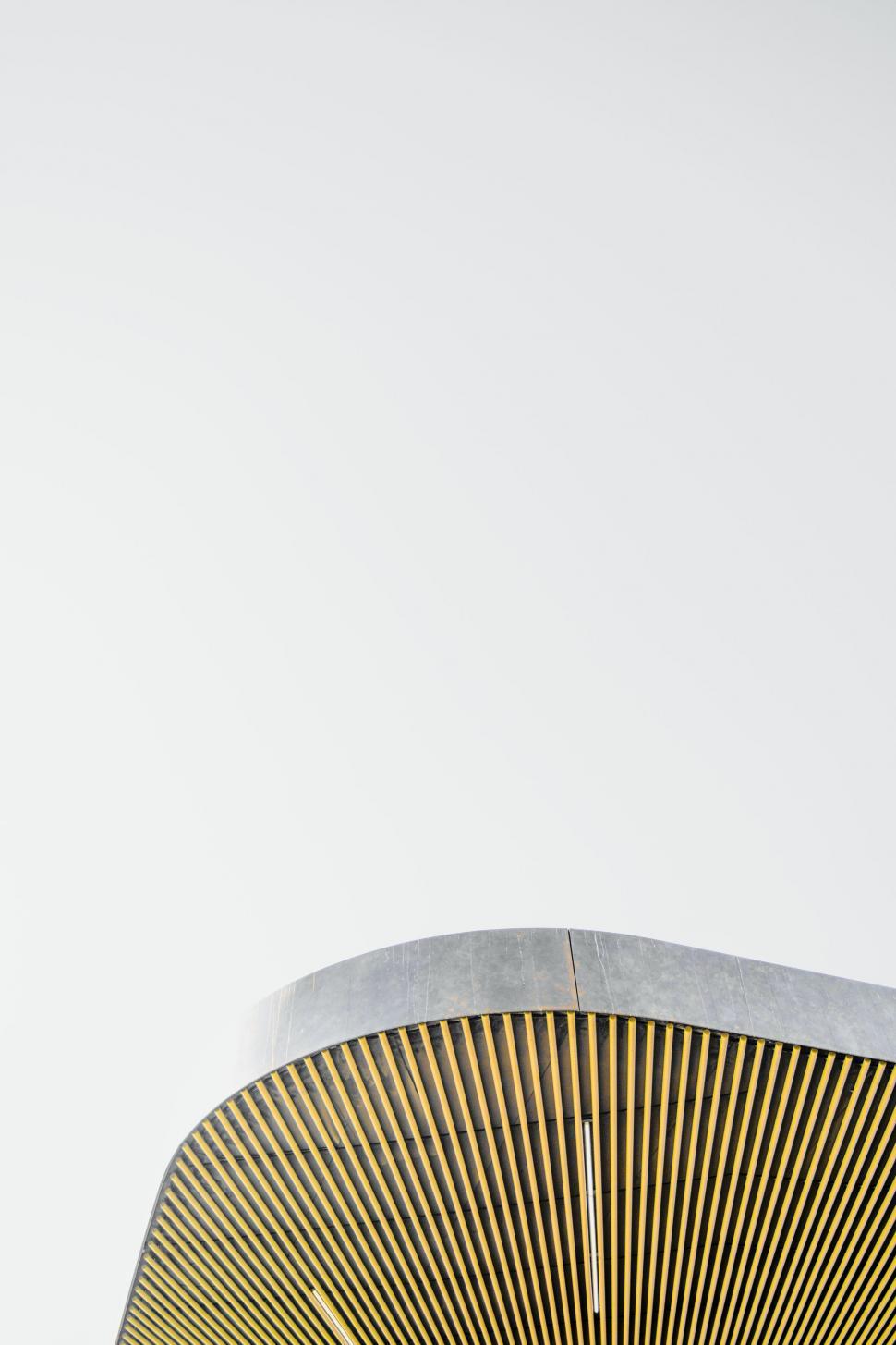 Free Image of Clock Mounted on the Side of a Building 