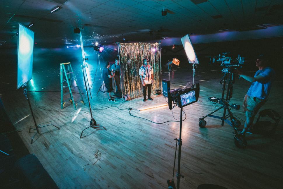 Free Image of Group of People Standing on Wooden Floor 