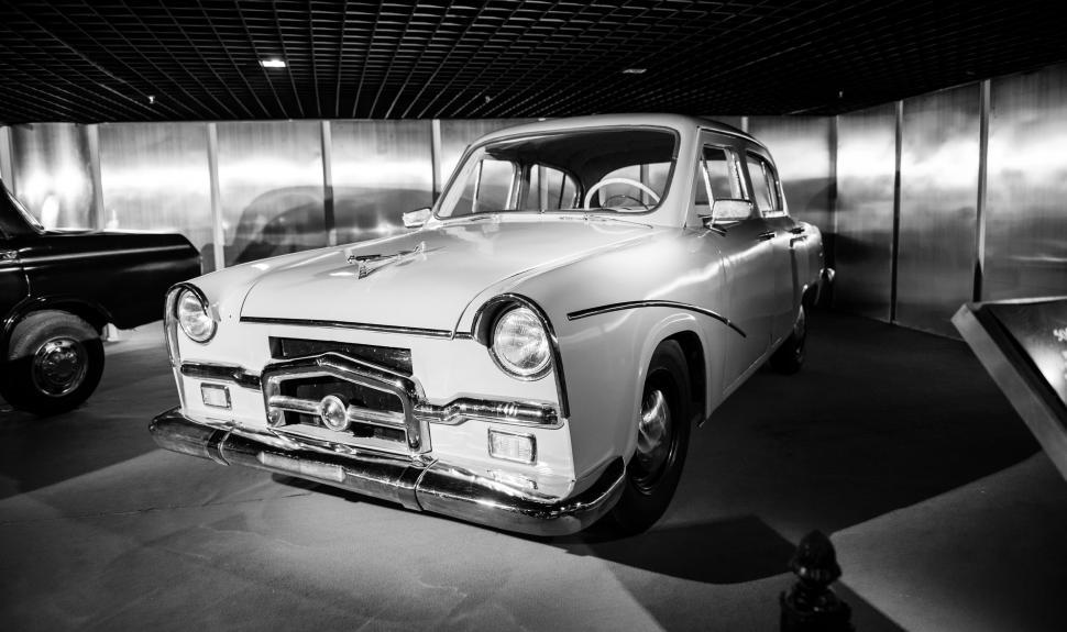 Free Image of Black and White Photo of a Car and a Truck 