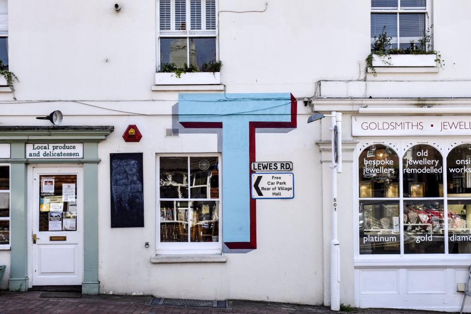 Free Image of White Building With Blue Cross 