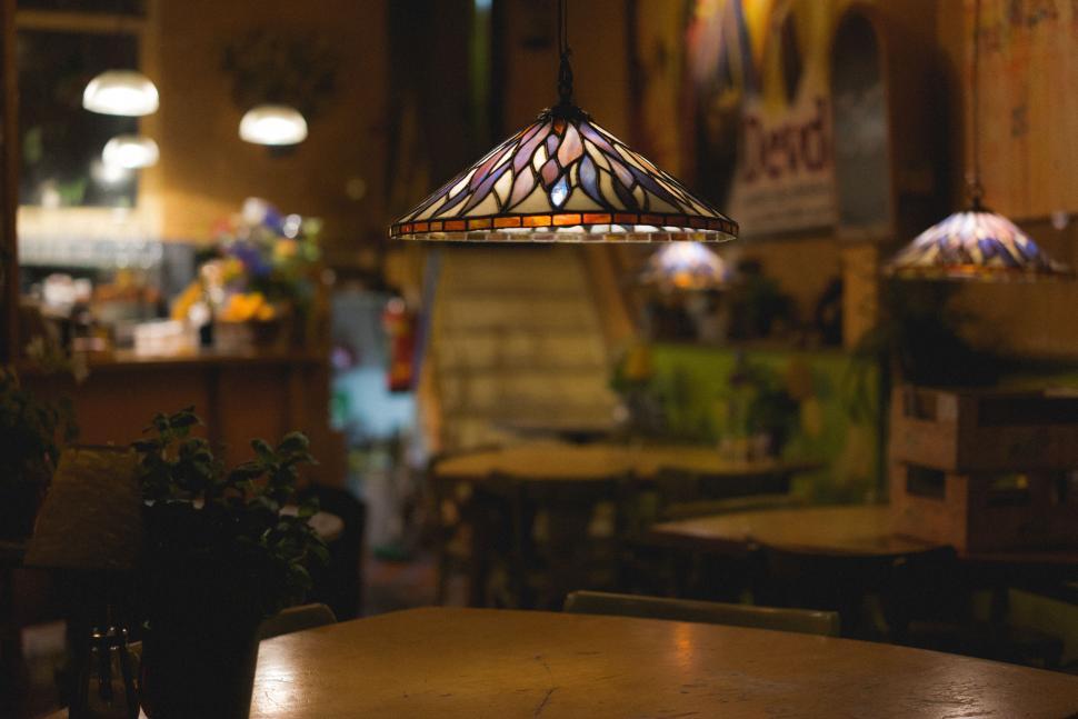 Free Image of Lamp Hanging Over Table in Restaurant 