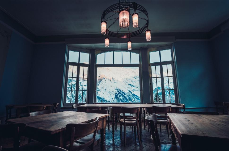 Free Image of Room With Table, Chairs, and Large Window 