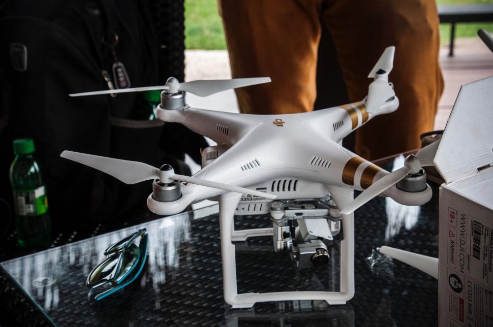 Free Image of White Remote Controlled Flying Device on Table 