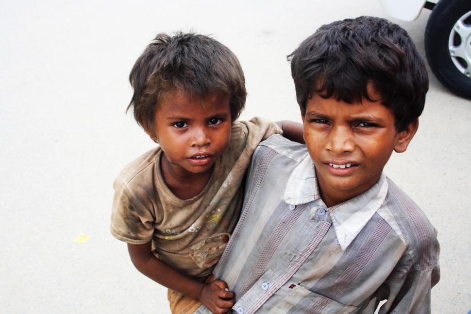 Free Image of Two Young Boys Standing Next to Each Other 