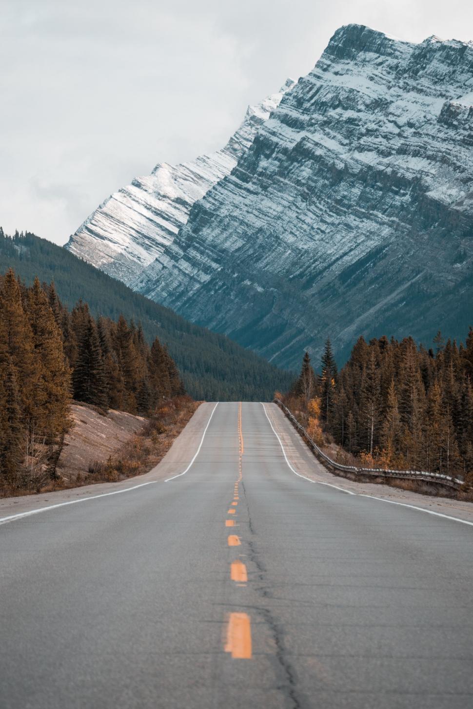 Free Image of Empty Road With Mountain in Background 