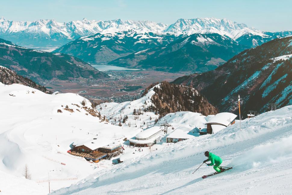 Free Image of Man Skiing Down Snow Covered Slope 