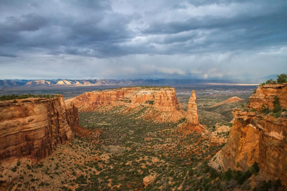 Free Image of Cloudy Sky Over Valley and Mountains 