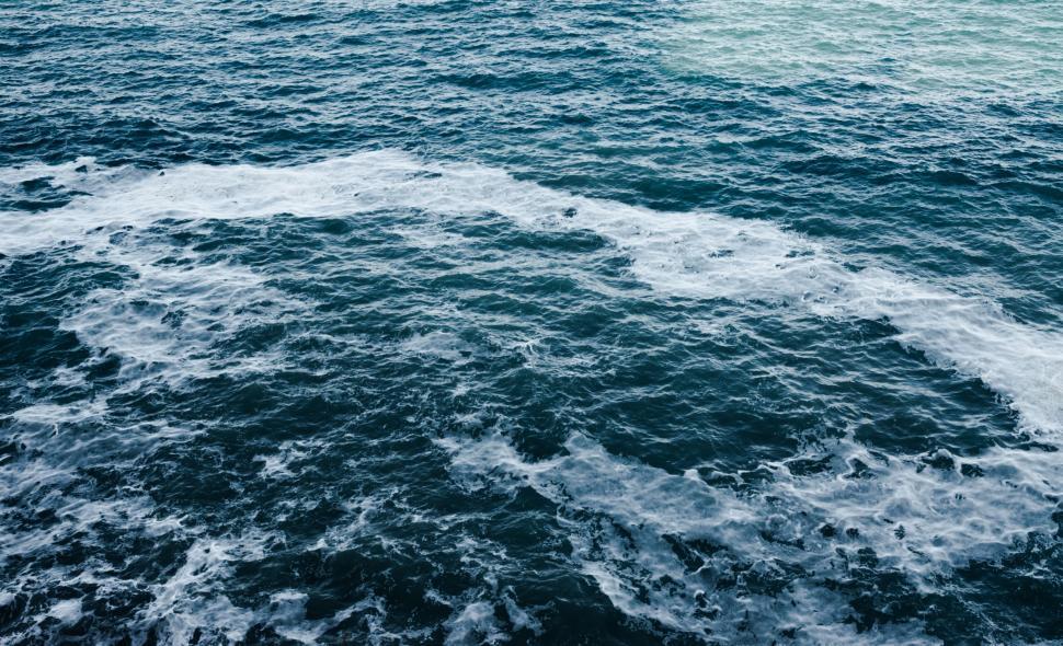 Free Image of Boat Sailing Across Vast Water 