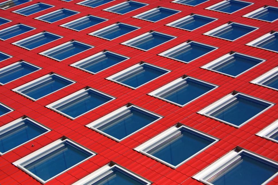 Free Image of Red Building With Many Windows 