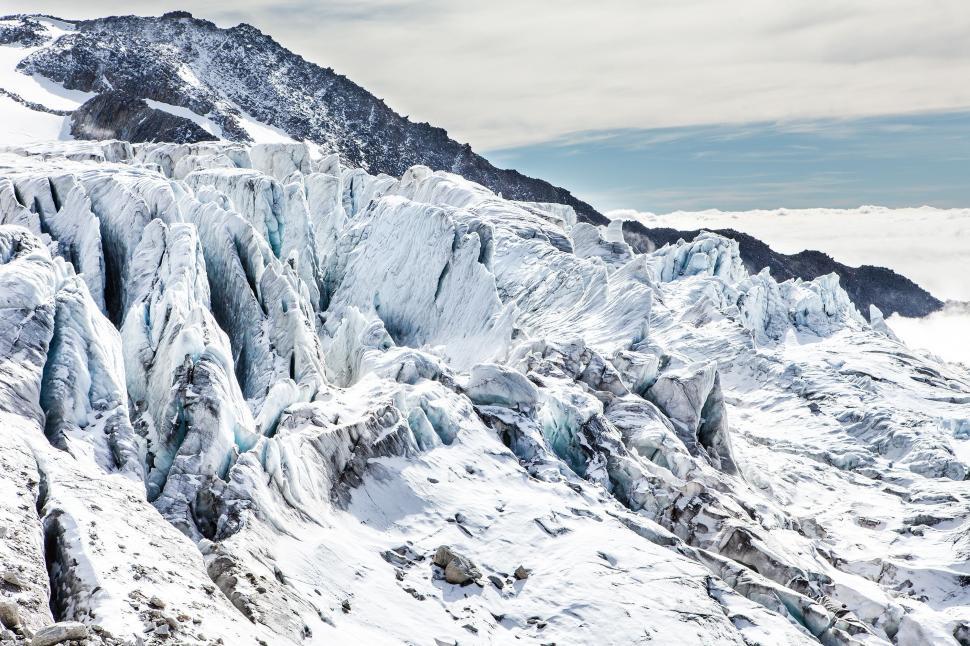 Free Image of Majestic Snow-Covered Mountain Under a Clear Sky 