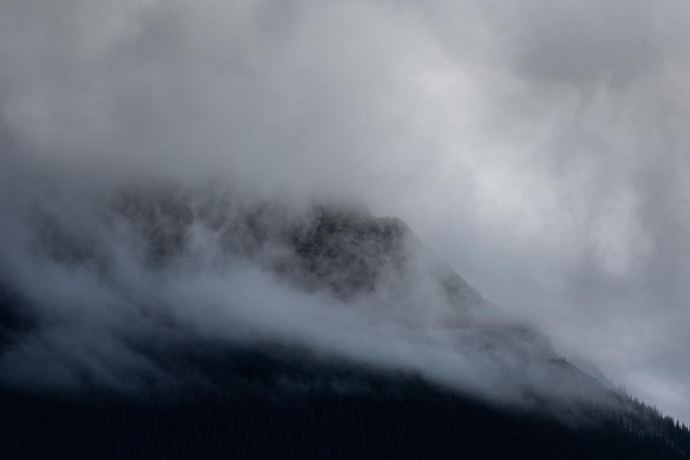 Free Image of Mountain Covered in Clouds 