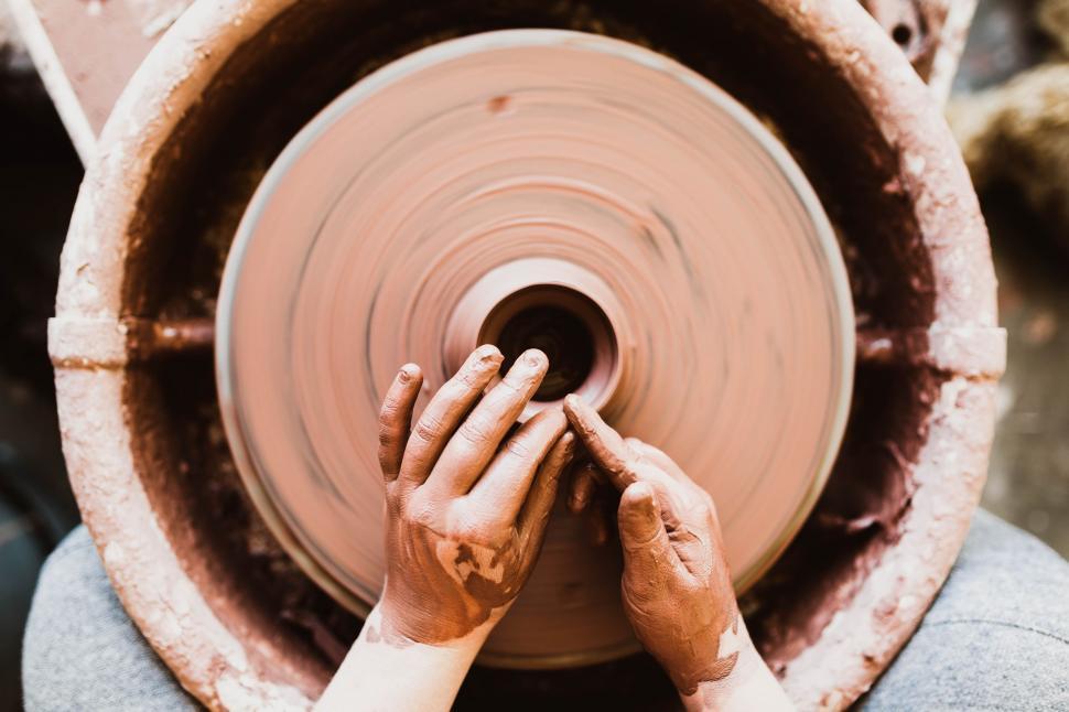 Free Image of Person Making a Pot on a Potters Wheel 