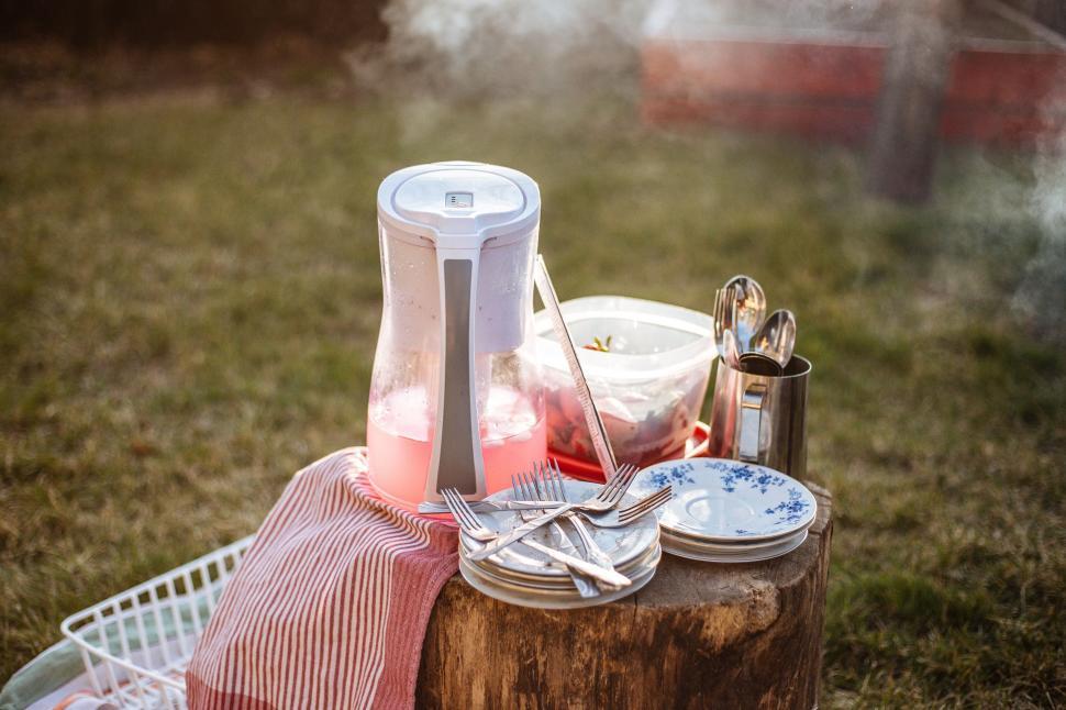 Free Image of Picnic Table Set With Utensils and Plates 
