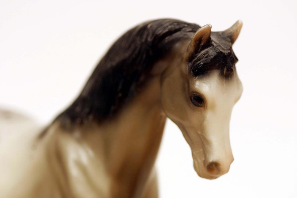 Free Image of Toy Horse Standing in Snow 